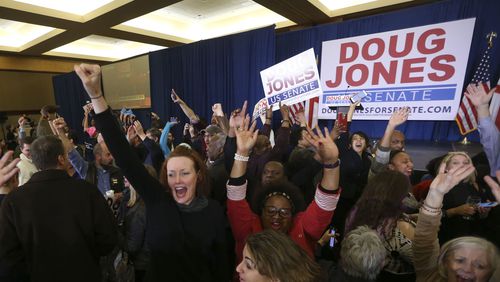 Supporters of Democratic candidate for U.S. Senate Doug Jones react Tuesday during an election-night watch party in Birmingham , Ala. Jones defeated Republican Roy Moore, and a number of Georgia Democrats played significant roles in his campaign. (AP Photo/John Bazemore)