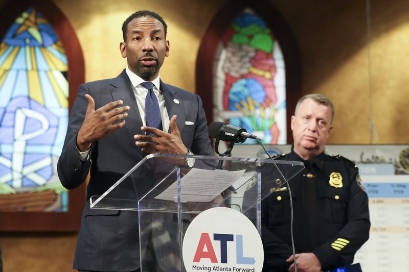 Atlanta Mayor Andre Dickens speaks to members of the media during a press conference next to Atlanta Police Department Chief Darin Schierbaum, right, to discuss reduced crime rate in Atlanta at Salem Bible Church, Thursday, January 4, 2024, in Atlanta. (Jason Getz / Jason.Getz@ajc.com)
