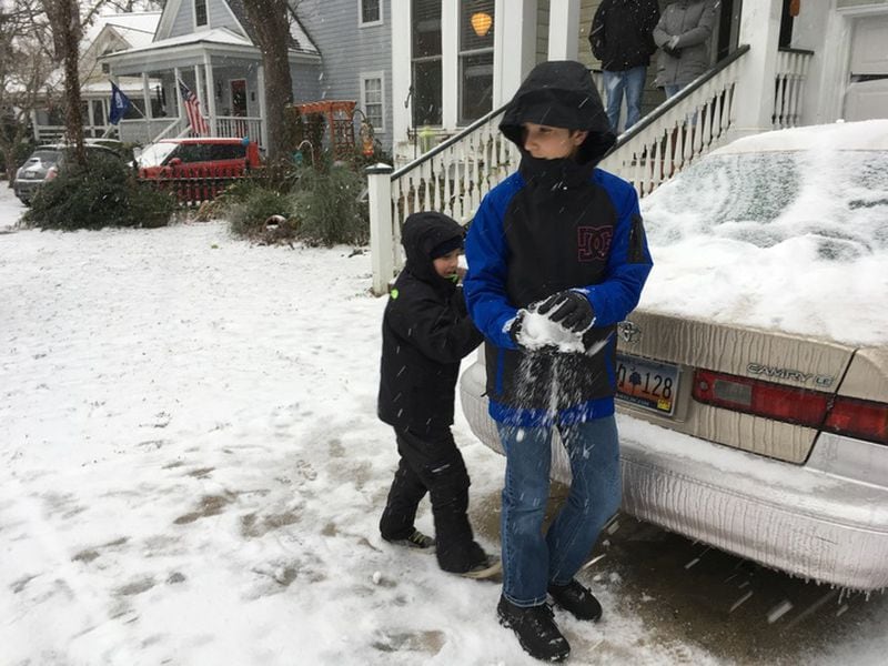 Two brothers indulge in a rare snowball fight outside of Charleston, S.C. (Credit: John Emerson)