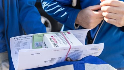 Health workers display an opioid resource kit. A new CDC study shows that unintentional deaths such as drug overdoses are among the causes leading to rural Georgians dying of preventable deaths at a higher rate than urban Georgians. (Kimberly Paynter/KFF Health News/TNS)
