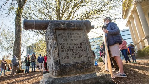 A rally in support of removal of a cannon in Decatur Square gathers Saturday, March 20, 2021.  The war relic serves as a monument in DeKalb County marking the end of the 1836 "Indian War."  Speakers from various groups note the oppression and forced removal of Native Americans and call for the cannon that was used against them to be removed.  (Jenni Girtman for The Atlanta Journal-Constitution)