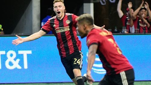 Atlanta United's Julian Gressel rejoices in teammate George Bello's goal earlier this month against the New England Revolution. (John Amis)