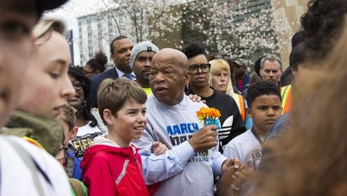 Congressman John Lewis marches with students during the March for our Lives event in Atlanta, Georgia, on Saturday, March 24, 2018. (REANN HUBER/REANN.HUBER@AJC.COM)