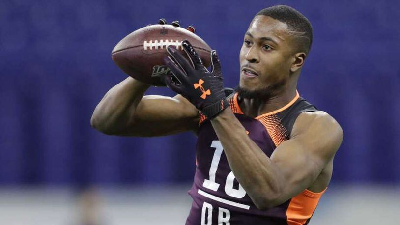 Houston cornerback Isaiah Johnson, an unpolished cornerback prospect, is a projected third-round pick. Here catching a ball at the NFL scouting combine. (Darron Cummings, Associated Press )