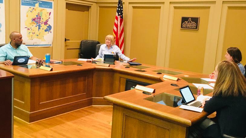 To maintain so-called “social distancing” only three of Decatur’s five commissioners were present during Monday’s meeting, l-r Mayor Pro Tem Tony Powers, Mayor Patti Garrett, City Manager Andrea Arnold and commissioner Kelly Walsh. Bill Banks for the AJC