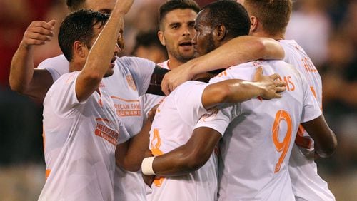 Atlanta United forward Romario Williams (right) celebrates his goal for a 3-0 victory over Charleston Battery with teammates during the second half in a U.S. Open Cup match on Wednesday, June 6, 2018, in Kennesaw.  Curtis Compton/ccompton@ajc.com