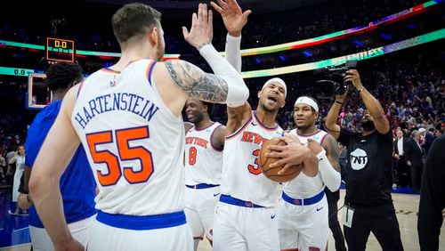 New York Knicks' Josh Hart (3) and teammate Isaiah Hartenstein (55) celebrate after winning Game 6 in an NBA basketball first-round playoff series against the Philadelphia 76ers, Thursday, May 2, 2024, in Philadelphia. (AP Photo/Matt Slocum)