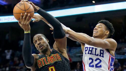 The Atlanta Hawks’ Dwight Howard (8) tries to fend off the Philadelphia 76ers’ Richaun Holmes (22) during the fourth quarter on Wednesday, March 29, 2017, at the Wells Fargo Center in Philadelphia. The Hawks won, 99-92. (Yong Kim/Philadelphia Daily News/TNS)