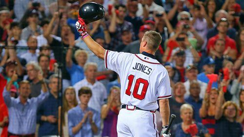 Chipper Jones tips his batting helmet to the fans as he takes the plate for the final at-bat of his career during the 9th inning in the National League wild card game Friday, Oct. 5, 2012, at Turner Field in Atlanta.