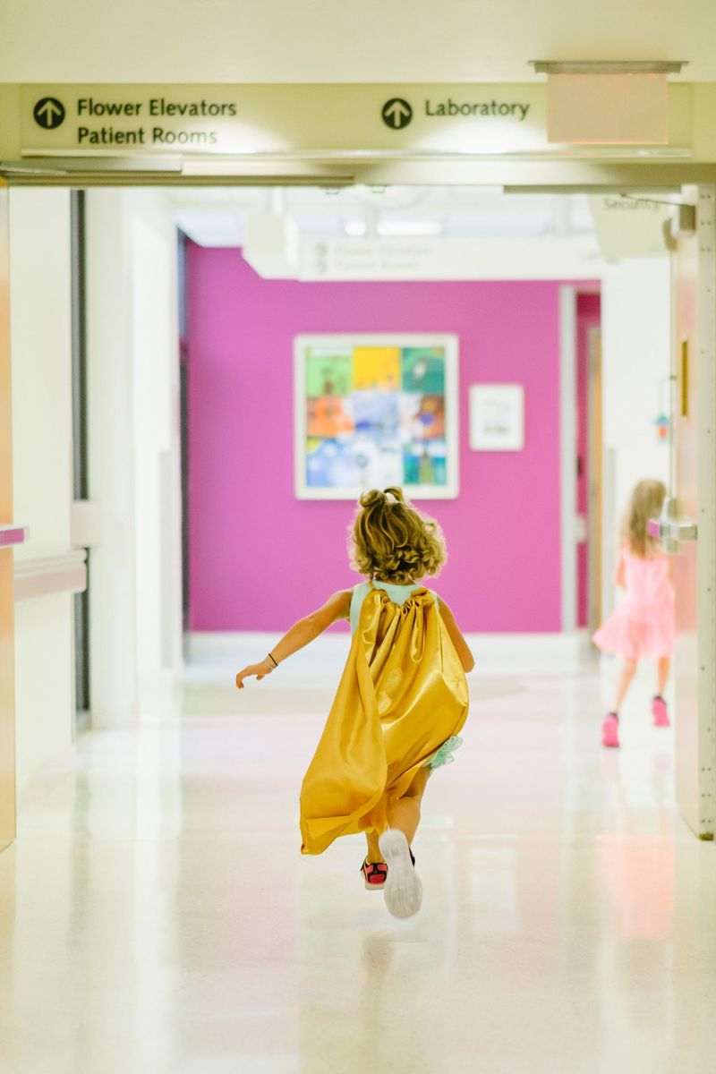 Two years ago, Hudson Lillystone, who was 6 at the time, dons her yellow cape for Cape Day. Hudson battled against acute lymphoblastic leukemia (ALL) at the Aflac Cancer and Blood Disorders Center at Children’s Healthcare of Atlanta. PHOTO BY AARON COURY