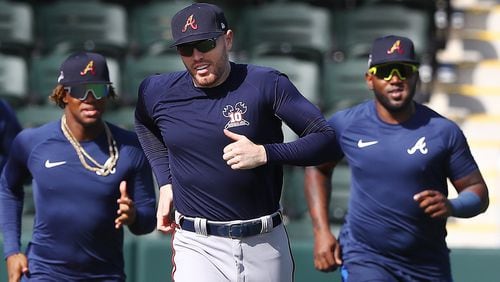 Braves Ronald Acuna (from left), Freddie Freeman and Marcell Ozuna run sprints around the bases Sunday, Feb. 16, 2020, at CoolToday Park in North Port, Fla.