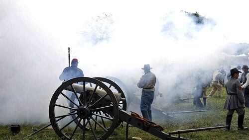 Smoke fills the air after a cannon is fired.