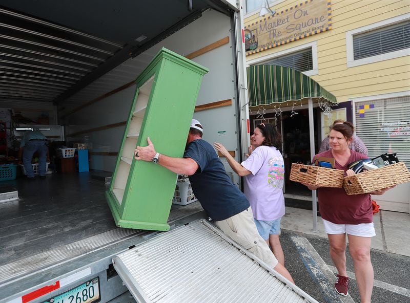 Family and friends help store owner Angie Mock (center) pack up items from her store Market on the Square in preparation for Hurricane Dorian on Monday, Sept. 2, 2019, in St. Marys. (Photo: Curtis Compton/ccompton@ajc.com)