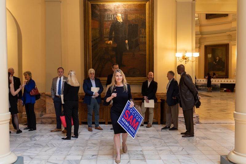 Sam Brown-Parks, running for state House District 54, steps out of line briefly during for qualifying Monday at the Capitol in Atlanta. (Arvin Temkar / arvin.temkar@ajc.com)