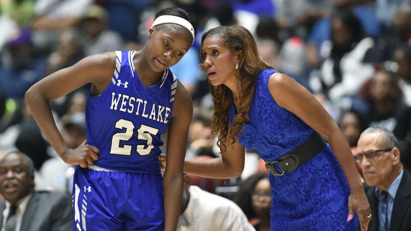 Head coach Hilda Hankerson instructs Raven Johnson (25), who has been a part of three state championship teams at Westlake.
