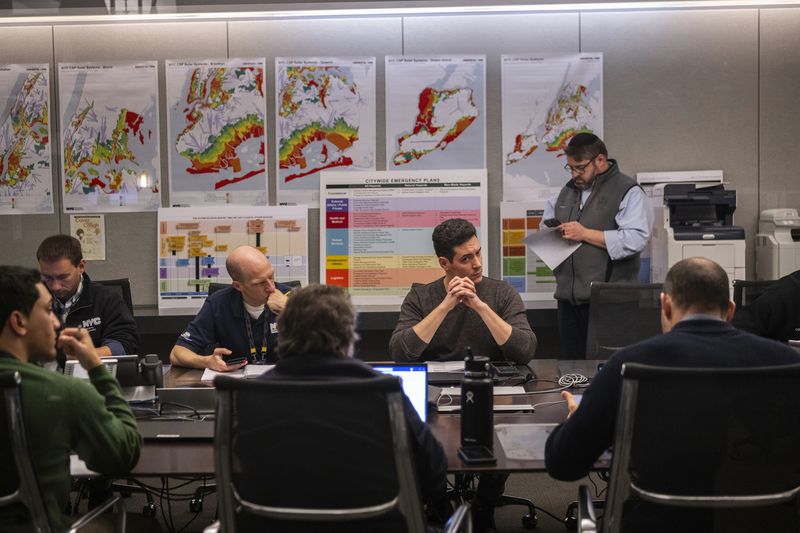 Members of the New York City Emergency Management Department hold a meeting on Friday, April 5, 2024 in New York. An earthquake shook the densely populated New York City metropolitan area Friday morning, the U.S. Geological Survey said, with residents across the Northeast reporting rumbling in a region where people are unaccustomed to feeling the ground move. (AP Photo/Brittainy Newman)