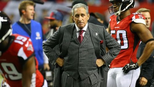 122814 ATLANTA: Falcons owner Arthur Blank prowls the field as his team prepares to face the Panthers for the NFC South title in a football game on Sunday, Dec. 28, 2014, in Atlanta. Curtis Compton / ccompton@ajc.com