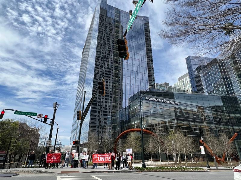 A few dozen protesters rallied in front of Norfolk Southern's headquarters in Midtown Atlanta on Saturday, March 11, 2023.