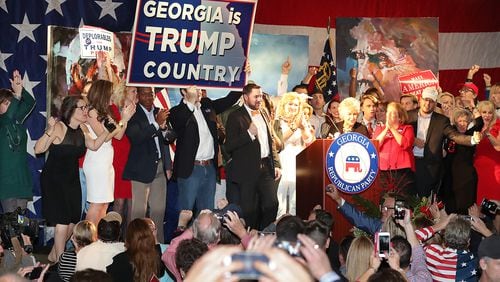 Republican voters celebrate as it is announced Trump wins Georgia at the Republican Watch party at the Grand Hyatt, Buckhead, on Tuesday, Nov. 8, 2016, in Atlanta. Curtis Compton /ccompton@ajc.com