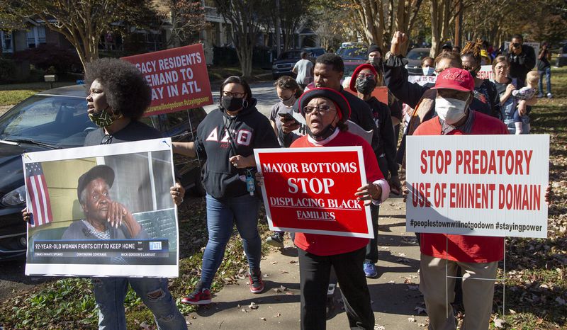 Tanya Washington (left) marches the block in Peoplestown with Bertha and Robert Darden after an rally last year. Dickens has pledged to work with the residents to help them stay in their homes after previous administrations filed evictions. (Phil Skinner for The Atlanta Journal-Constitution) 