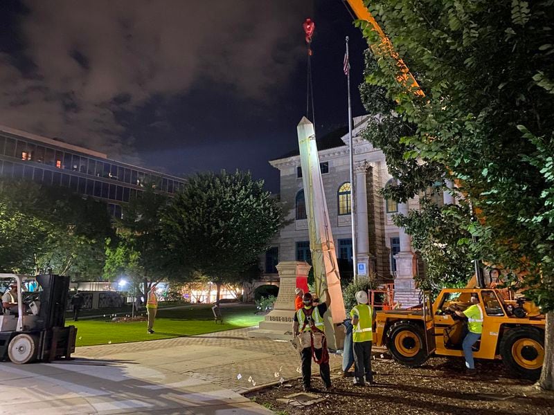 The Confederate obelisk in downtown Decatur was removed from its pedestal late Thursday night. 