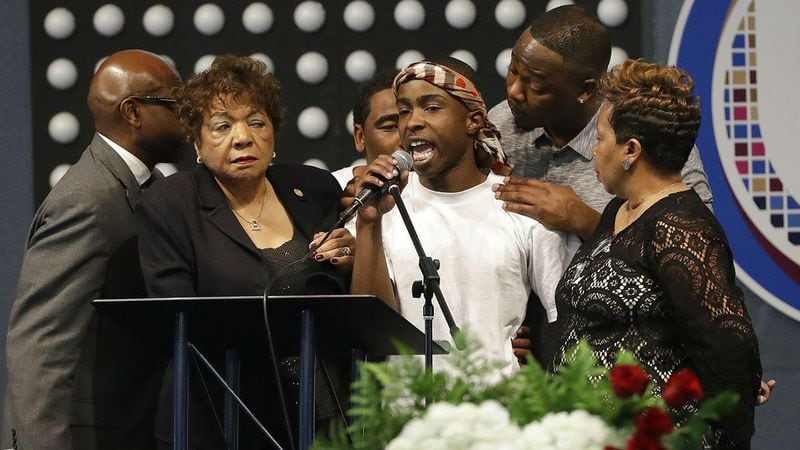 Stevante Clark, center, speaks during the funeral of his brother, Stephon Clark, Thursday, March 29, 2018, at Bayside of South Sacramento Church. Stephon Clark, 22, died March 18 after two Sacramento police officers fired 20 rounds at him as he stood on his grandparents' back patio, unarmed and holding a cellphone. His killing has sparked protests across Sacramento and beyond.