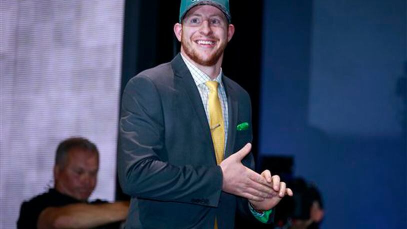 North Dakota State�s Carson Wentz walks on the stage after being selected by Philadelphia Eagles as second pick in the first round of the 2016 NFL football draft, Thursday, April 28, 2016, in Chicago. (Jeff Haynes/AP Images for Panini)