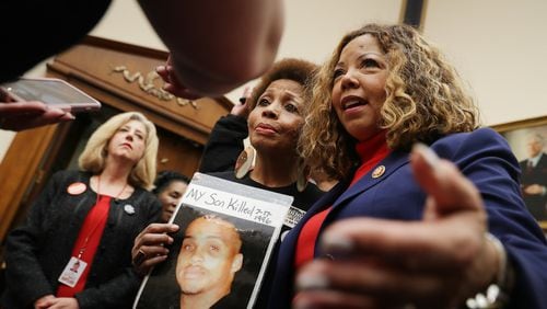 The Brady Campaign’s Mattie Scott (C) and Rep. Lucy McBath (D-GA), both of who lost sons to gun violence, pose for photographs before a hearing on gun violence legislation in the Rayburn House Office Building on Capitol Hill Feb. 06, 2019, in Washington, DC. Gun-control groups poured $4 million into McBath’s Georgia campaign, reflecting a resurgence of the anti-gun lobby in political giving. CHIP SOMODEVILLA / GETTY IMAGES