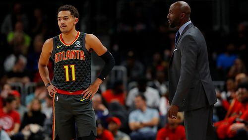 Coach Lloyd Pierce of the Hawks converses with Trae Young against the Chicago Bulls at State Farm Arena on November 06, 2019 in Atlanta, Georgia. (Photo by Kevin C. Cox/Getty Images)