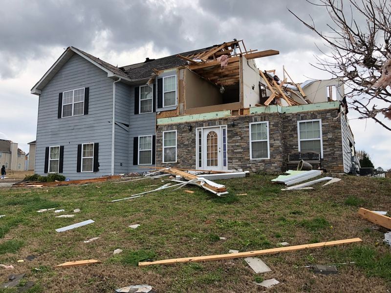 A home heavily damaged by a tornado that swept through the Chestnut Ridge subdivision in Fairburn on Monday night.