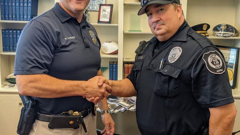 Canton Police Officer Lou Louzader (right) has been dedicated to serving the department and the community for the past 18 years. Pictured here with Deputy Police Chief Wendell Turner, he retired in August. CONTRIBUTED