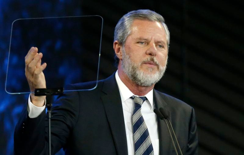 Liberty University, led by Jerry Falwell Jr., is pushing for criminal trespassing charges to be lodged against two journalists who pursued stories about why the evangelical college has remained partially open during the coronavirus outbreak. (AP Photo/Steve Helber, File)