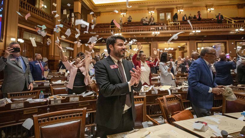 Georgia House members toss paper at the conclusion of the 2022 legislative session. Many bills are still awaiting votes before the end of this year's session, which will come around midnight Wednesday. Branden Camp / For The Atlanta Journal-Constitution
