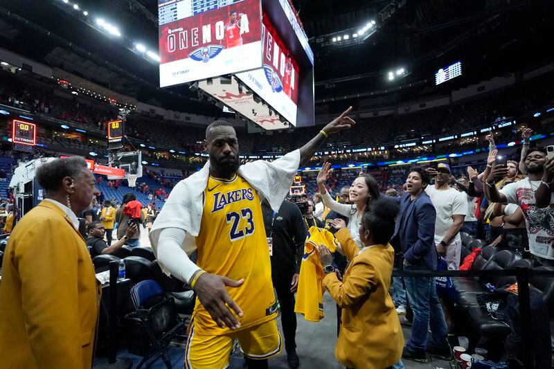 Los Angeles Lakers forward LeBron James (23) acknowledges fans as he leaves the court after an NBA basketball play-in tournament game against the New Orleans Pelicans, Tuesday, April 16, 2024, in New Orleans. The Lakers won 110-106. (AP Photo/Gerald Herbert)
