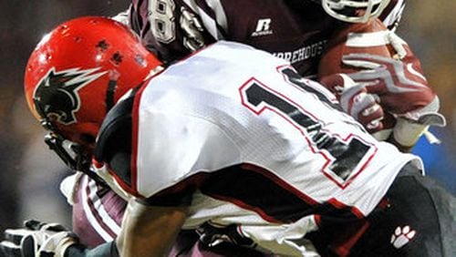 Morehouse Derrick Hector (85) gets hit by Clark Atlanta Brandon Wilkerson (19) after he made a catch in the first half at B.T. Harvey Stadium in Morehouse College in this 2011 file photo.
