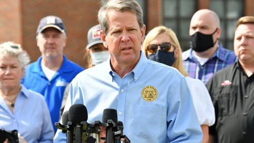 Georgia Gov. Brian Kemp speaks to the media outside Newnan High School in the aftermath of the tornado that tore through the Newnan on Saturday. Kemp’s office that the governor was exposed to a person with COVID-19 while touring the storm damage. He tested negative for the disease early Monday. (Hyosub Shin / Hyosub.Shin@ajc.com)