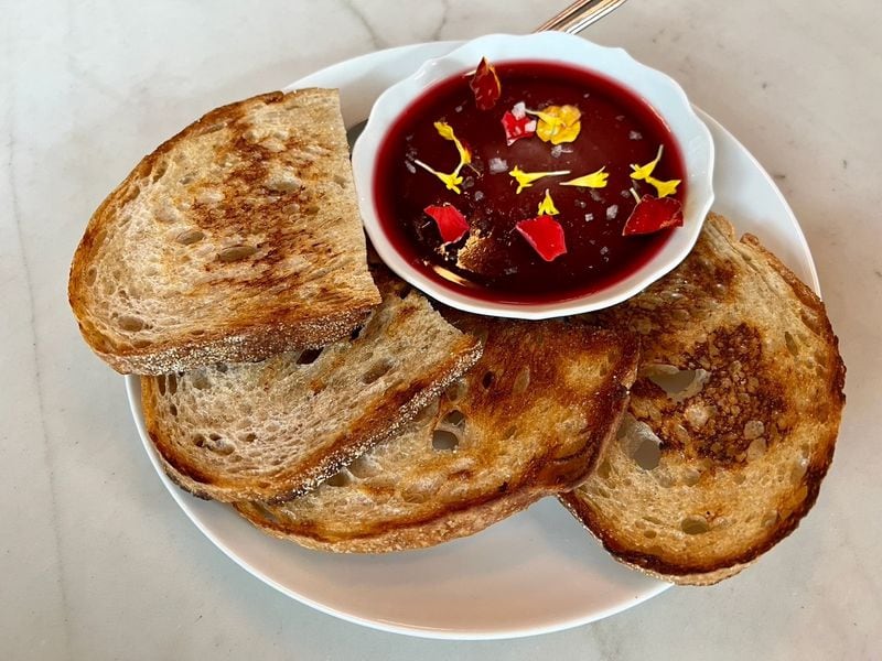 Lucian’s chicken liver pate with hibiscus gelee and toast is a fine starter, and pairs very well with the wine. Henri Hollis for The Atlanta Journal-Constitution