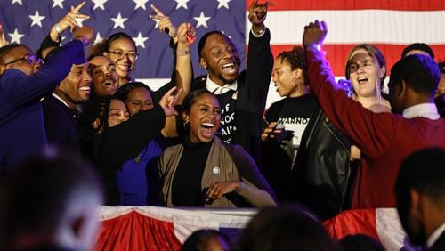 Supporters of Sen. Raphael Warnock cheer after hearing final results at his election night watch party at Atlanta Marriott Marquis on Tuesday, December 6, 2022. (Natrice Miller/natrice.miller@ajc.com)  