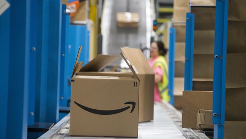 An Amazon package is prepared for distribution at the Fulfillment Center in Jefferson.