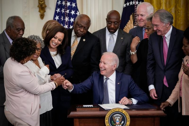 U.S. President Joe Biden signs the Juneteenth National Independence Day Act into law in the East Room of the White House on June 17, 2021 in Washington, D.C. The Juneteenth holiday marks the end of slavery in the United States and the Juneteenth National Independence Day will become the 12th legal federal holiday - the first new one since Martin Luther King Jr. Day was signed into law in 1983. (Drew Angerer/Getty Images/TNS)