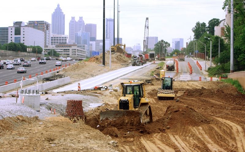 The 14th Street Bridge project was one of C.W. Matthews’ biggest projects. They're shown here working on Techwood Drive (the red dirt) and the new 10th Street exit ramp (newly paved in the middle) alongside the Downtown Connector Thursday, April 30, 2009.