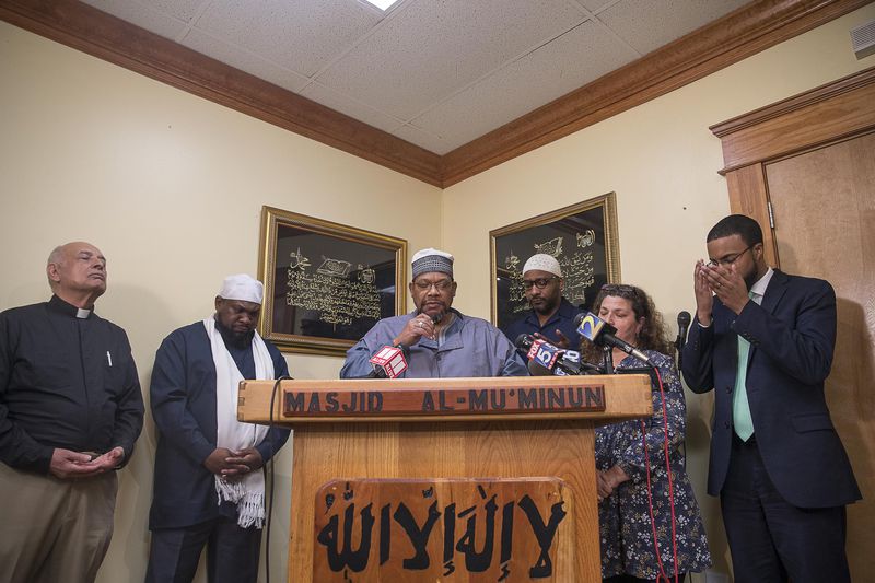  Imam Furqan Muhammad leads a prayer following a press conference at the Masjid Al-Mu'minun mosque in Atlanta's Peoplestown neighborhood, Friday, March 15, 2019. The press conference was called as a result of the mass shooting that killed 49 people worshipping at a mosque in New Zealand. Members of local metro Atlanta mosques and other faith organizations came to together to condemn the actions of the shooter and encourage other houses of worship to instate more security. 