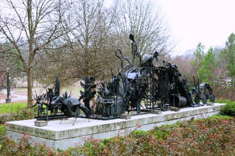 “The Bridge,” by Thornton Dial, is a 42-foot-long sculptural work that honors the civil rights activism of U.S. Rep. John Lewis, as well as the neighborhood activism of the Freedom Park Conservancy, a group that successfully stopped a throughway from dividing their neighborhood. (CONTRIBUTED BY STEPHEN PITKIN)