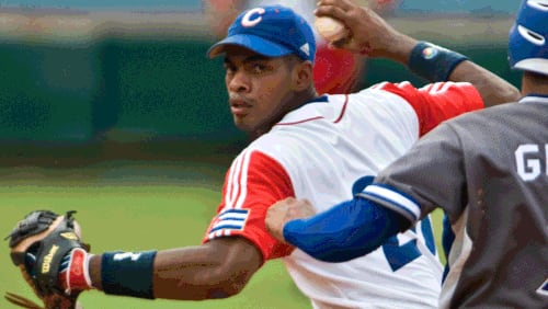 Hector Olivera will play third base for the Braves, likely as early as Monday at Turner Field.