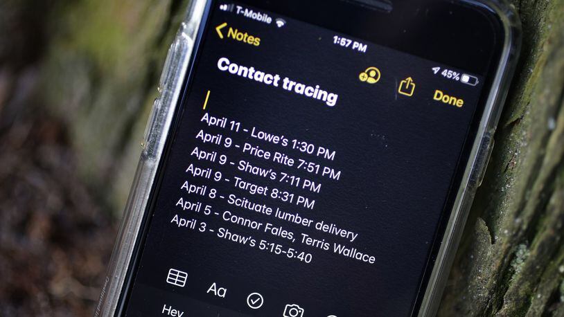 A smartphone shows notes made for future contact tracing Wednesday, April 15, 2020. (AP Photo/Steven Senne)