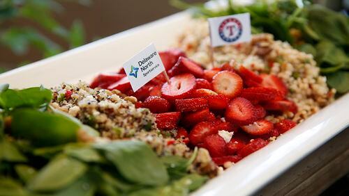 This healthy Globe Life Park salad features strawberries, quinoa, baby spinach and toasted walnuts in Arlington, Texas. (Rose Baca/Dallas Morning News/TNS)