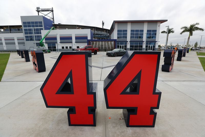 Braves retired numbers, including Hank Aaron's 44, are placed in the plaza in front of the ticket windows and merchandise store at CoolToday Park in North Port, Florida. (Curtis Compton/ccompton@ajc.com)