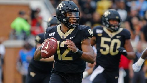 Wake Forest quarterback Jamie Newman looks to pass against North Carolina in Winston-Salem, N.C., Friday, Sept. 13, 2019. Wake Forest won 24-18. (AP Photo/Nell Redmond)