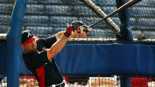 082813 Atlanta: Braves second baseman Dan Uggla is back from the disabled list 15 days after undergoing eye surgery to correct vision problems taking batting practice before the team plays the Cleveland Indians on Wednesday, August 28, 2013, in Atlanta. CURTIS COMPTON / CCOMPTON@AJC.COM