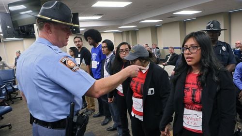 November 9, 2016 - Atlanta - Karen Ventura, the third protestor from right, participated Wednesday in a demonstration against Georgia Board of Regents policies that bar immigrants without legal status from attending five of the state’s top schools and paying in-state tuition rates at its others. Ventura, who has received a special reprieve from deportation, fears what will happen now that Donald Trump has been elected president: “We will be the first ones to be deported,” said Ventura, who is attending Atlanta-based Freedom University, a tuition-free school that helps prepare immigrants without legal status for college. “We are kind of trapped in a way.” BOB ANDRES /BANDRES@AJC.COM